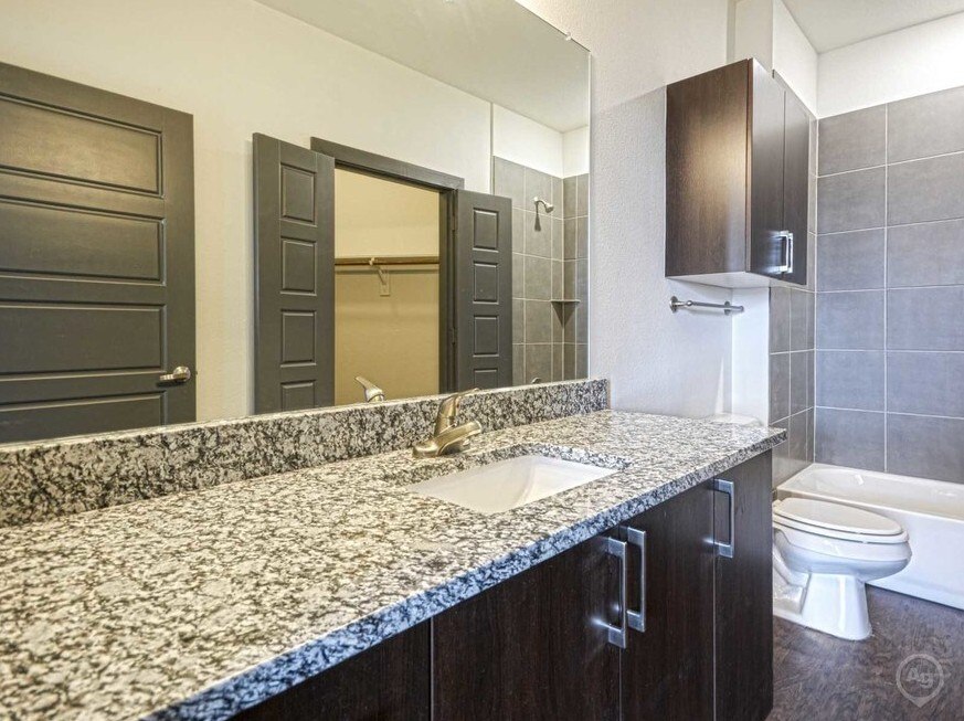 Bathroom with sink at SEVEN TWELVE LOFTS Apartments, Denton